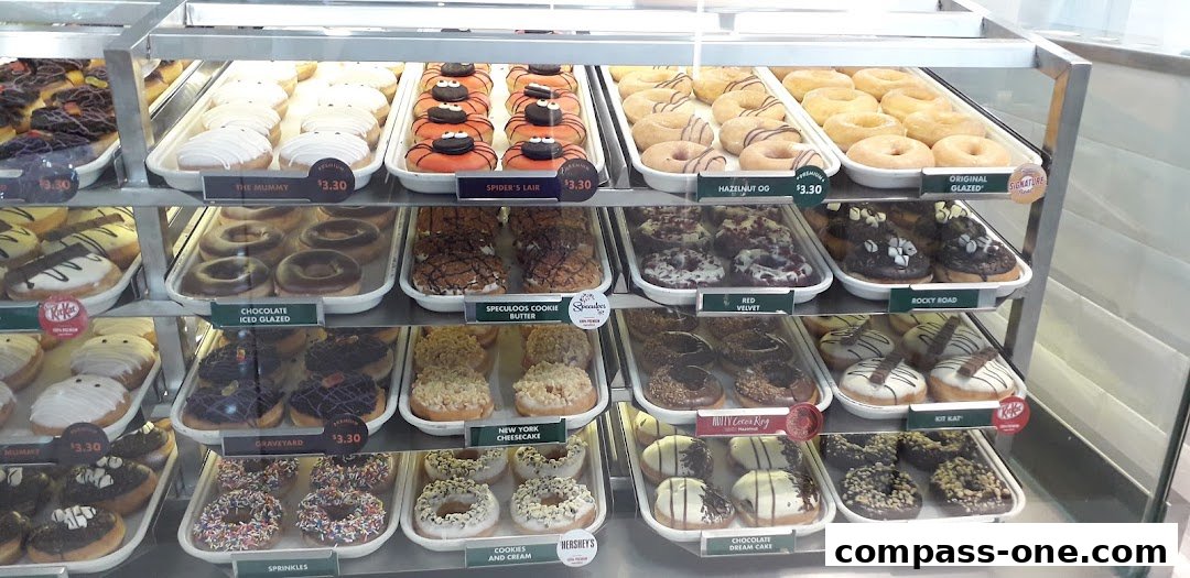 A display case filled with a variety of colorful and delicious donuts.