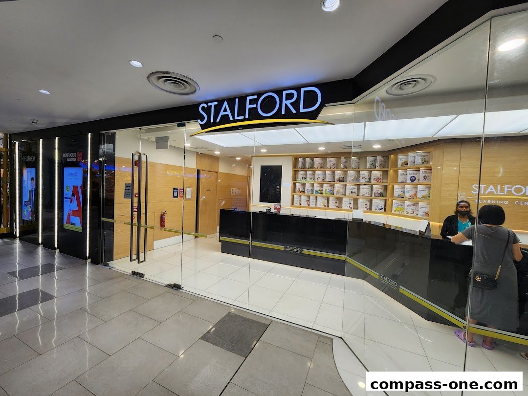 The entrance of Stalford Learning Centre with a reception desk and shelves of books.