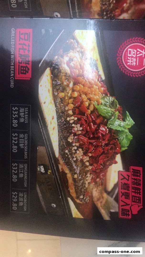 A menu featuring a close-up of a spicy grilled fish dish with various fish options and prices.