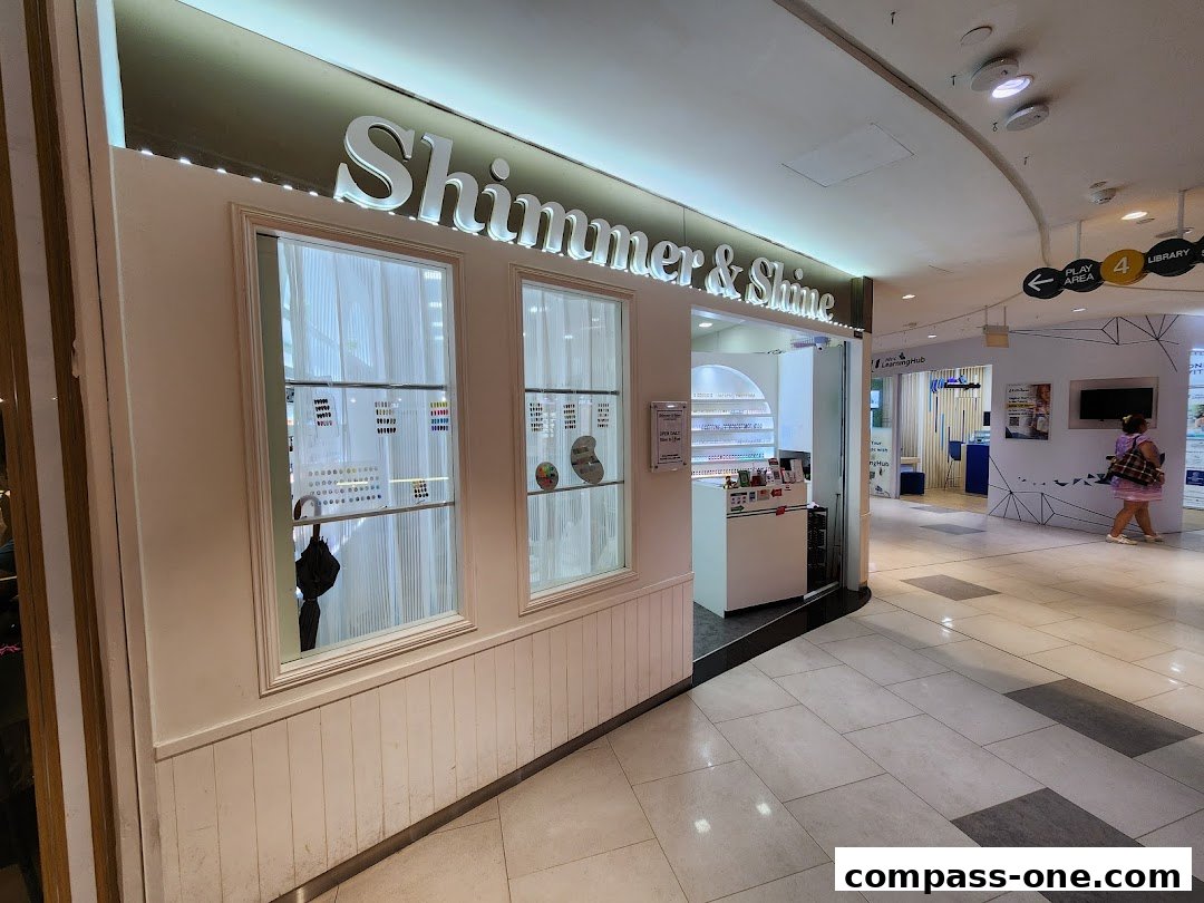The Shimmer & Shine shop front displays a variety of nail polish colors and beauty products.