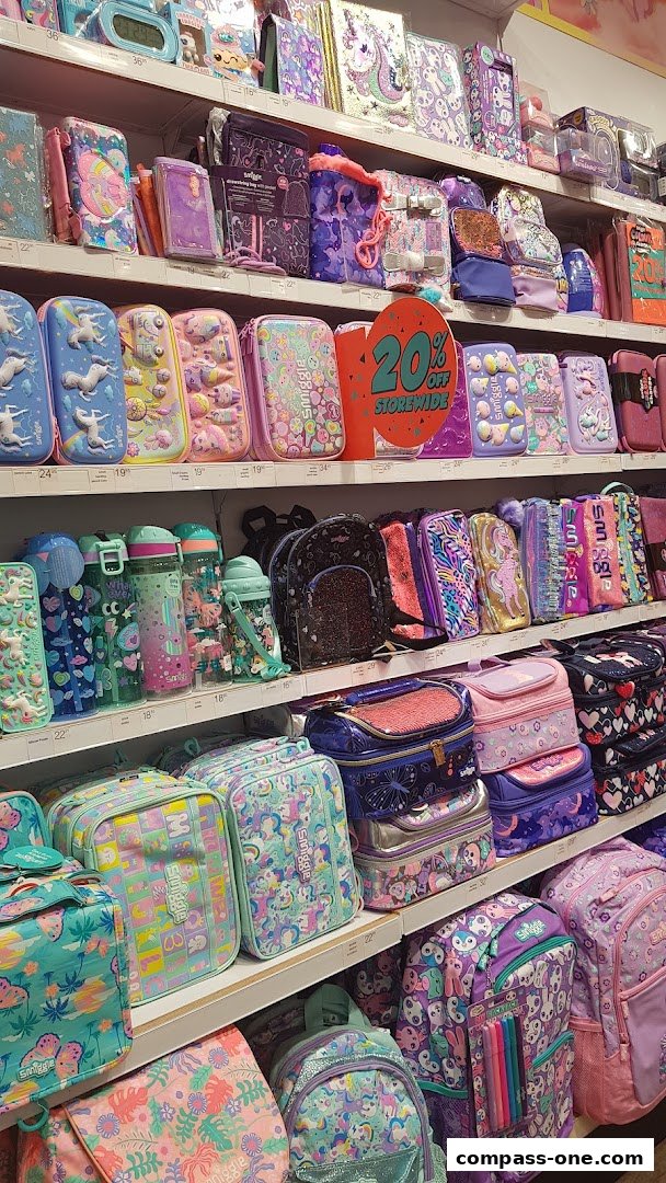 Shelves filled with colorful Smiggle stationery, bags, and accessories featuring unicorns and playful designs.