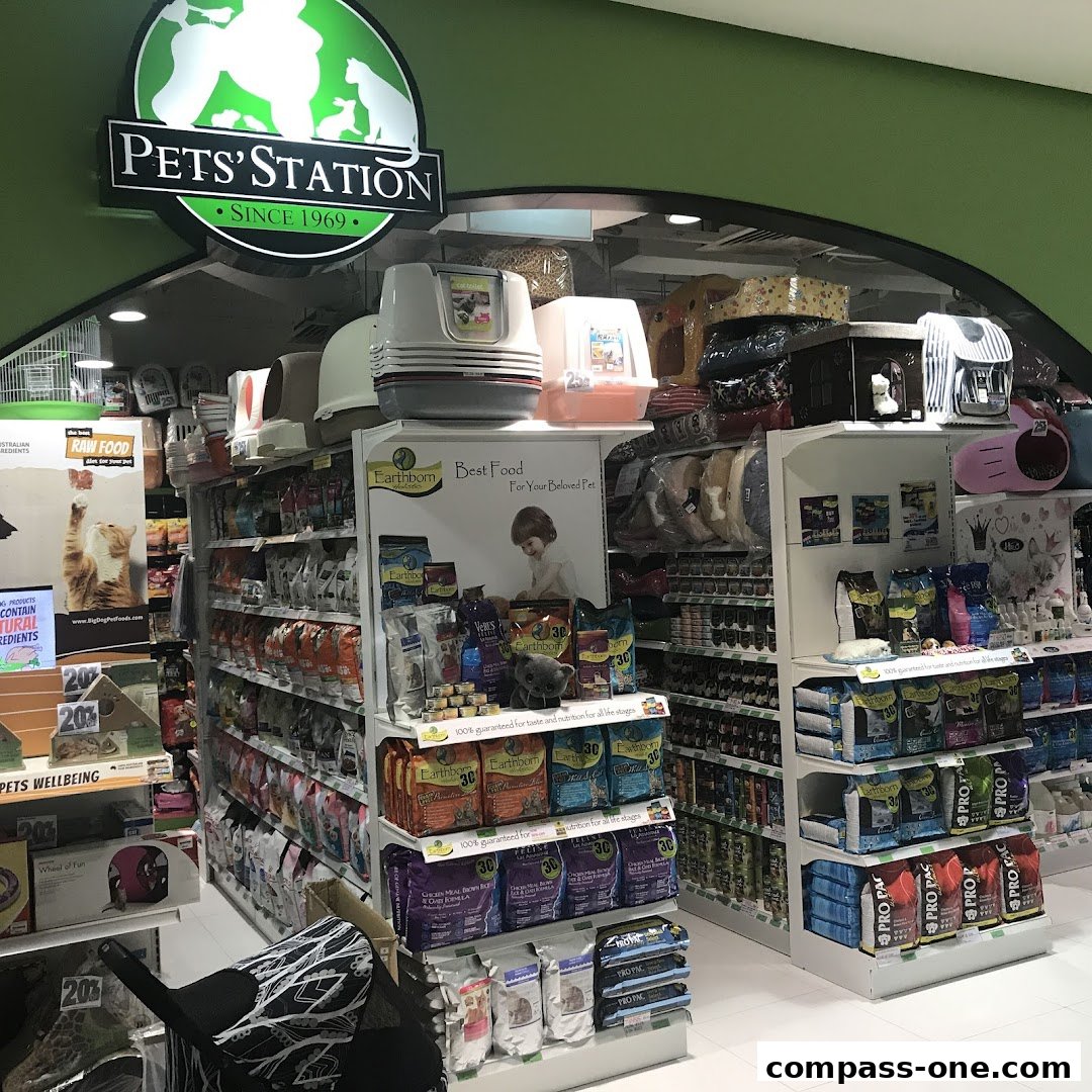 A well-stocked pet store with shelves full of pet food, litter boxes, and accessories.