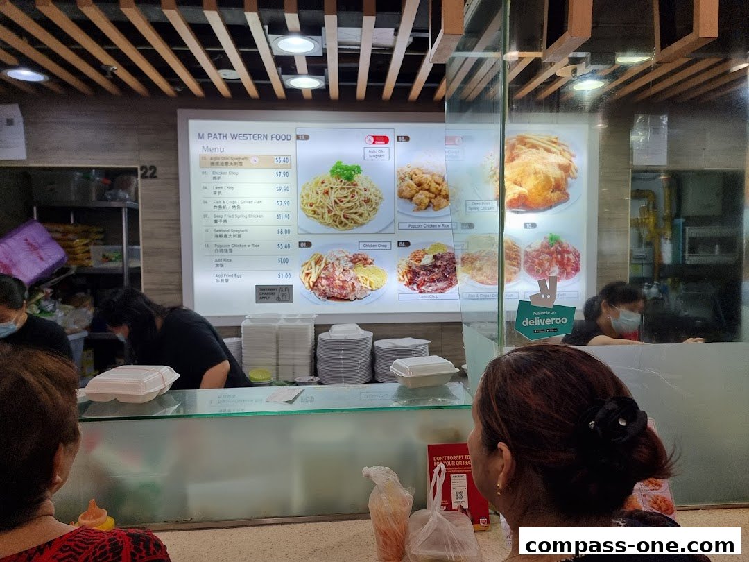 A menu board for M Path Western Food with various dishes and prices displayed.