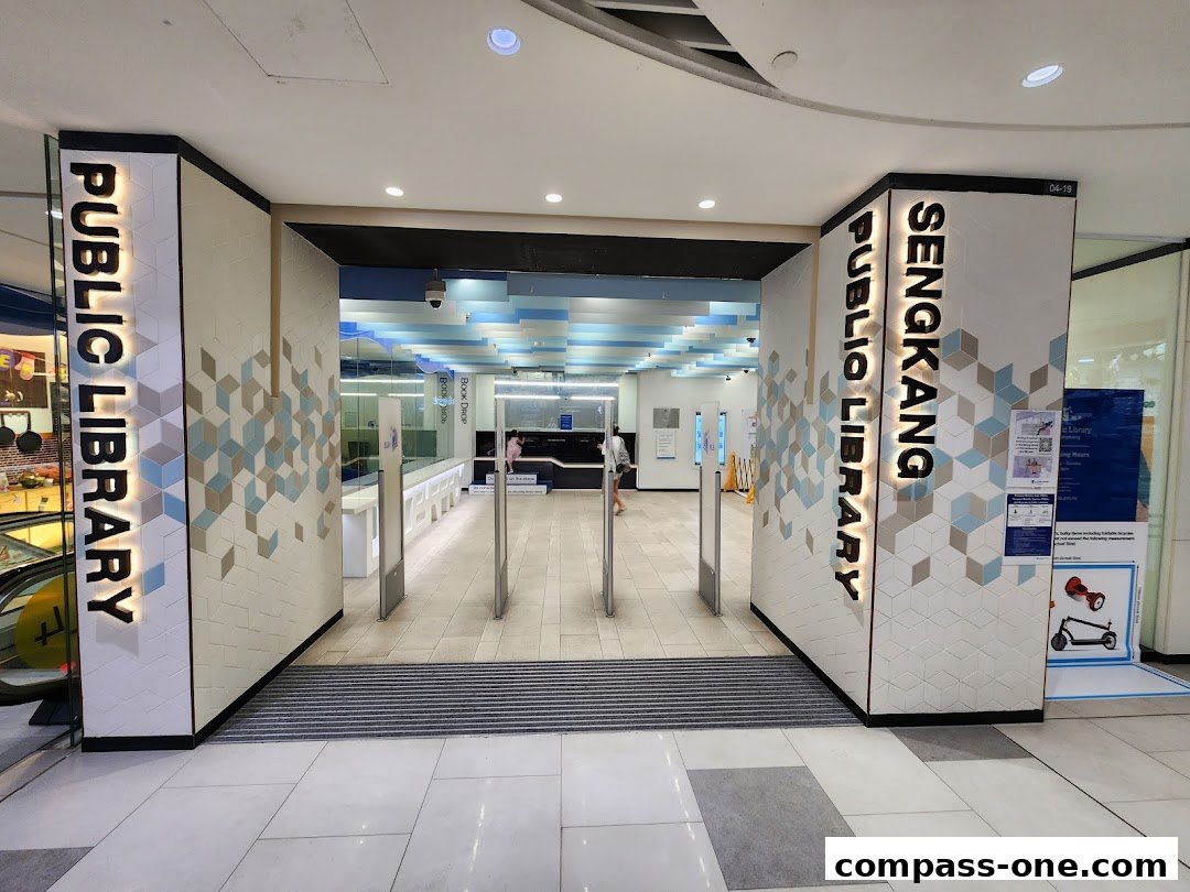 The entrance to Sengkang Public Library with illuminated signage and modern geometric decor.