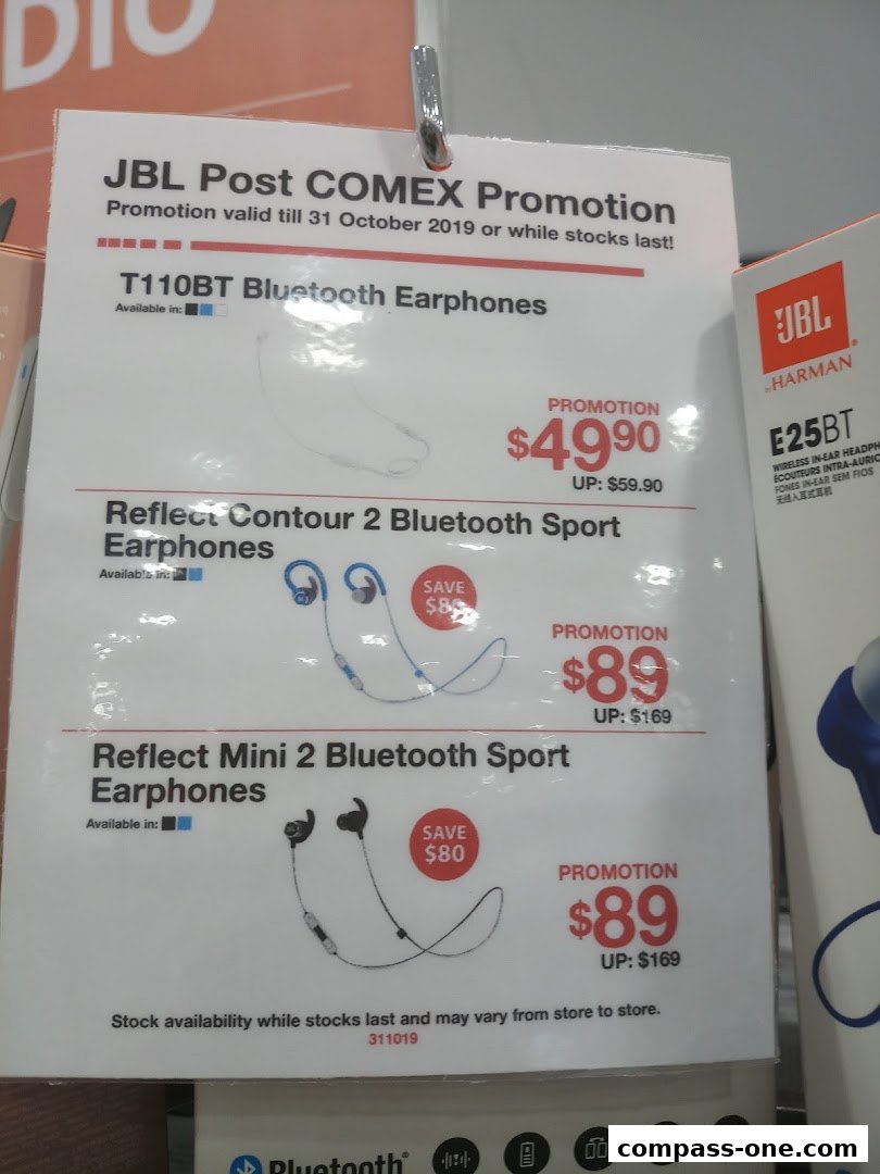 A promotional sign for JBL Bluetooth earphones with prices and discounts.