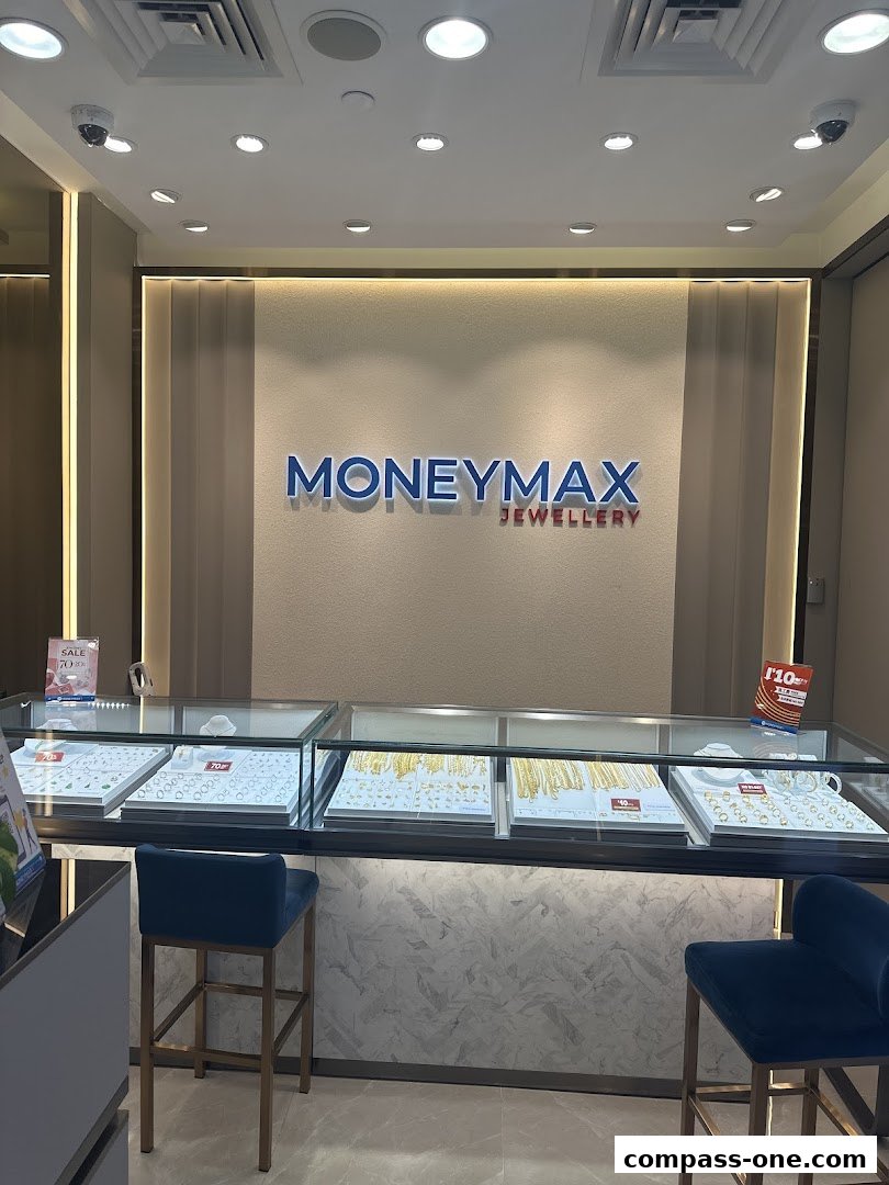 Interior view of a jewelry store with display cases showcasing necklaces and rings.