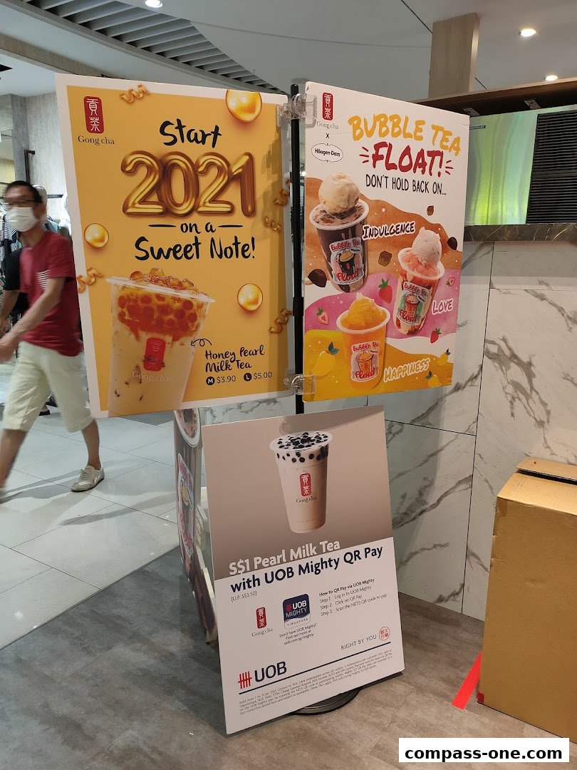 Promotional posters for Gong Cha bubble tea and a special offer with UOB Mighty QR Pay.
