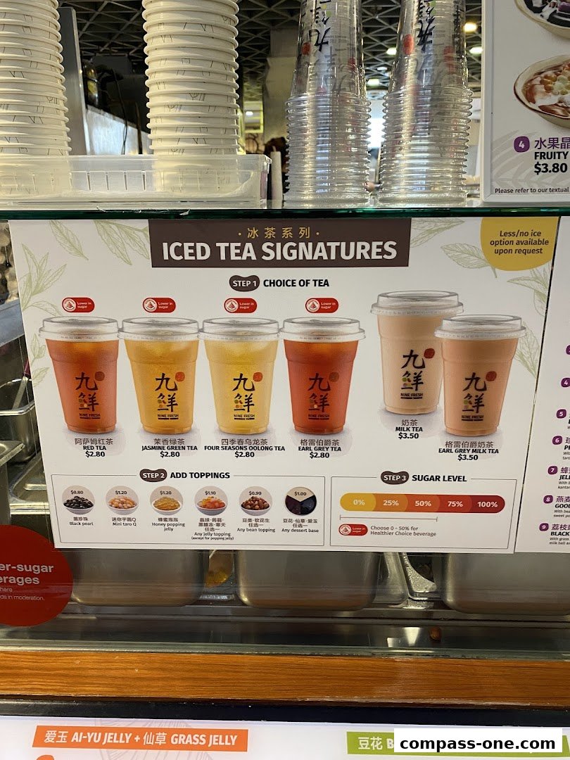 A menu board for Nine Fresh Desserts Taiwan featuring iced tea signatures, toppings, and sugar levels.