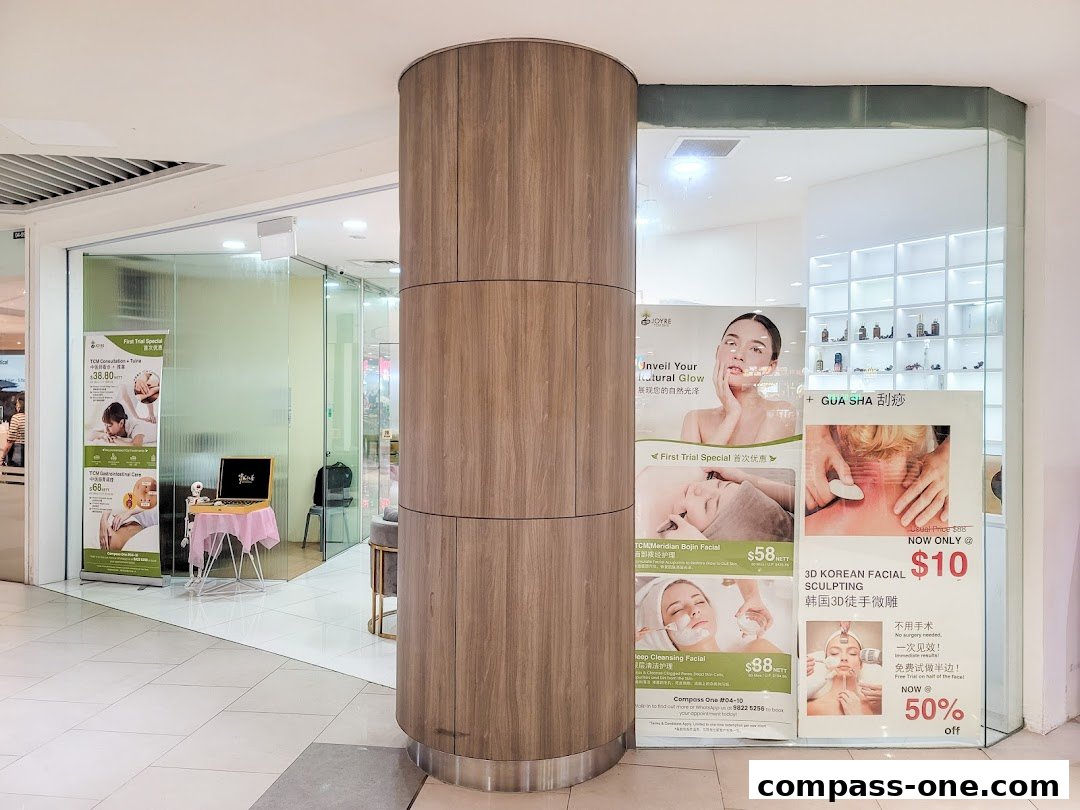 Shop front display with promotional posters for various spa treatments and services.