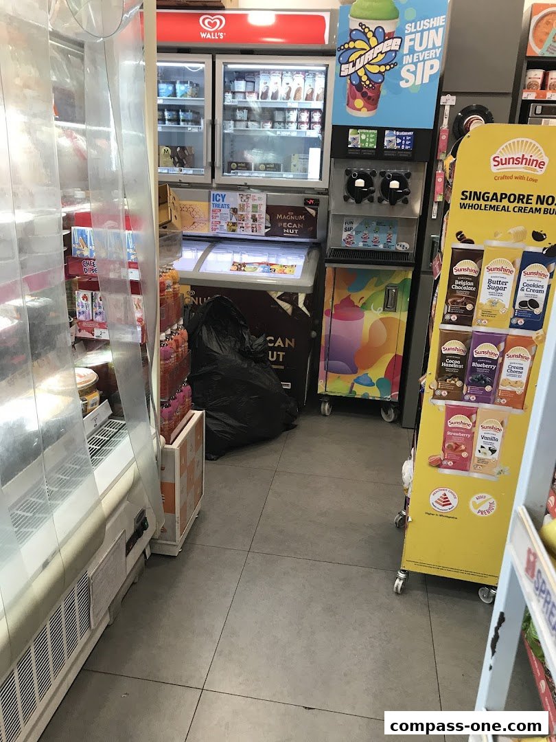 Interior view of a 7-Eleven store with frozen treats and drinks.