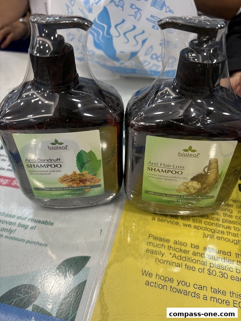 Two bottles of Bioleaf shampoo, one for anti-dandruff and one for anti-hair loss.