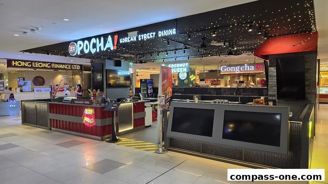 The exterior of POCHA! Korean Street Dining with its prominent signage and seating area.