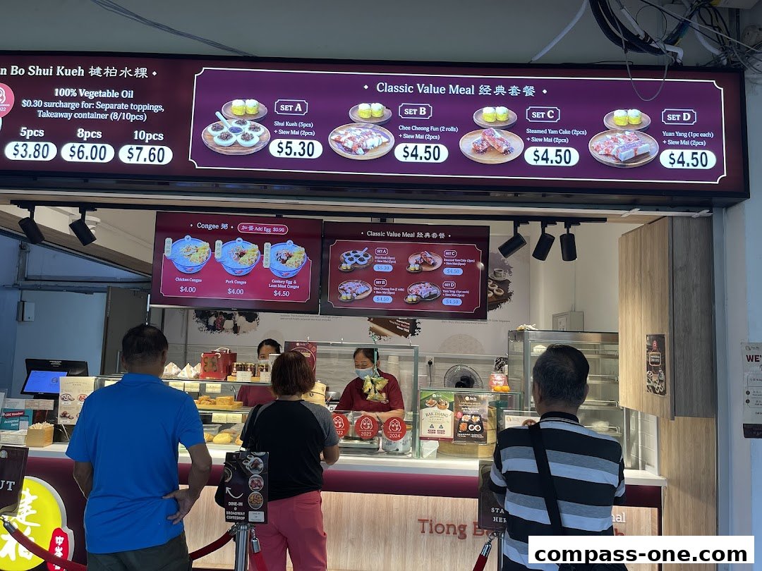 A brightly lit food stall menu displaying classic value meals and congee options.