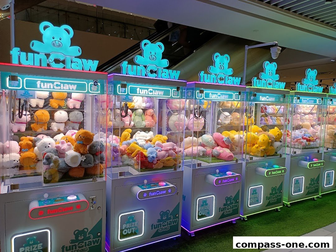 A row of colorful plush toy claw machines with the "fun Claw" logo and teddy bear branding.