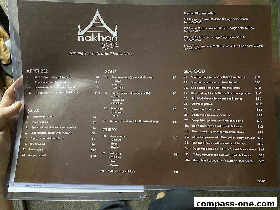 A menu from Nakhon Kitchen showing various Thai dishes and their prices.