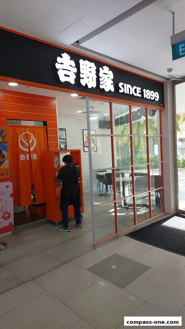 The entrance of Yoshinoya restaurant with its prominent signage and interior visible.