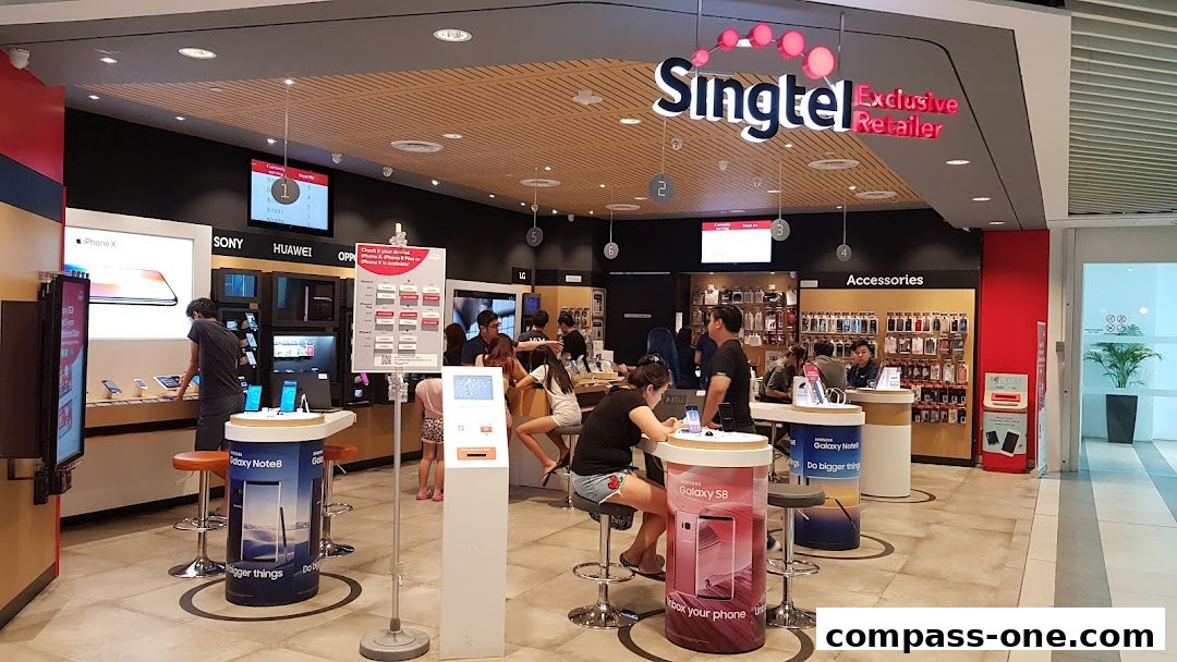 Interior view of a Singtel Exclusive Retailer shop showcasing mobile phones and accessories.