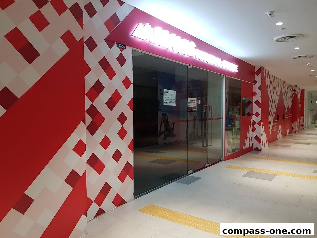 The entrance of Mavis Tutorial at Compass One, featuring a modern design with red and white geometric patterns.