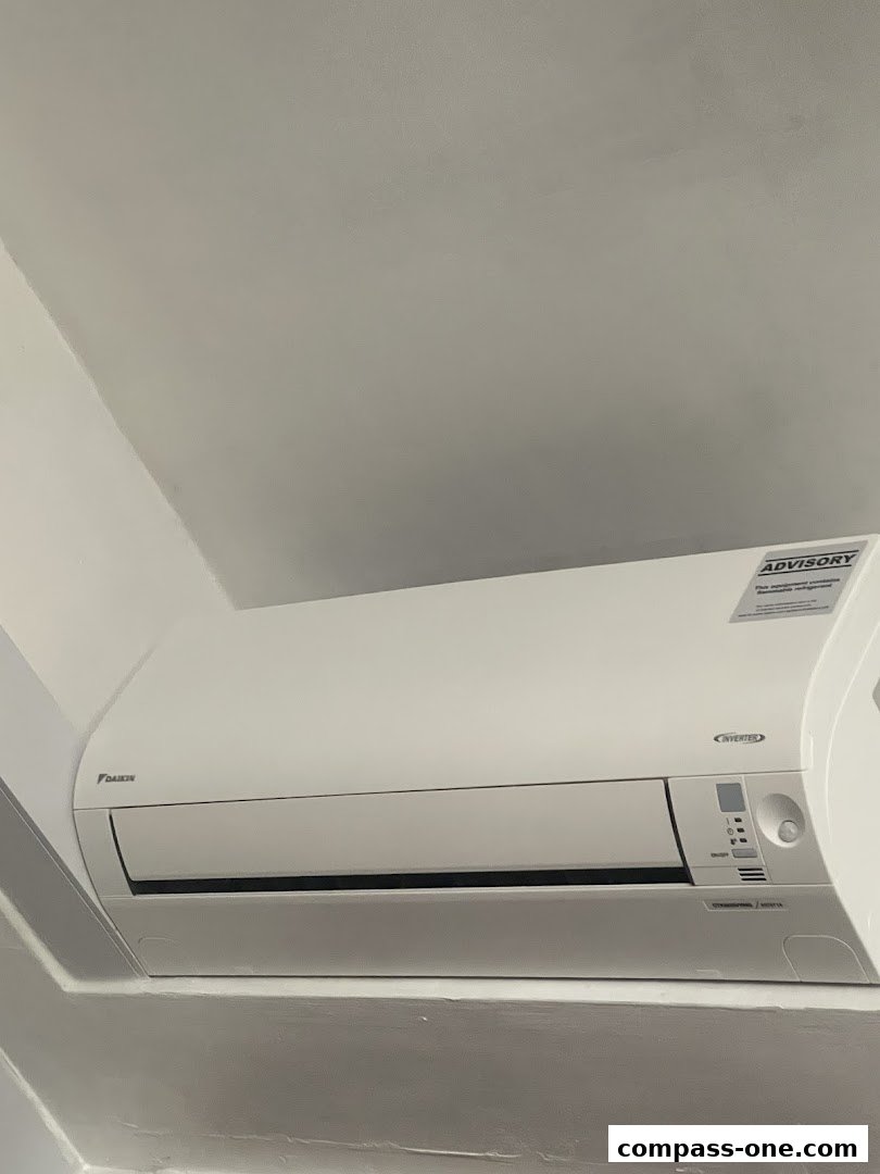 A Daikin inverter air conditioning unit mounted on a wall.