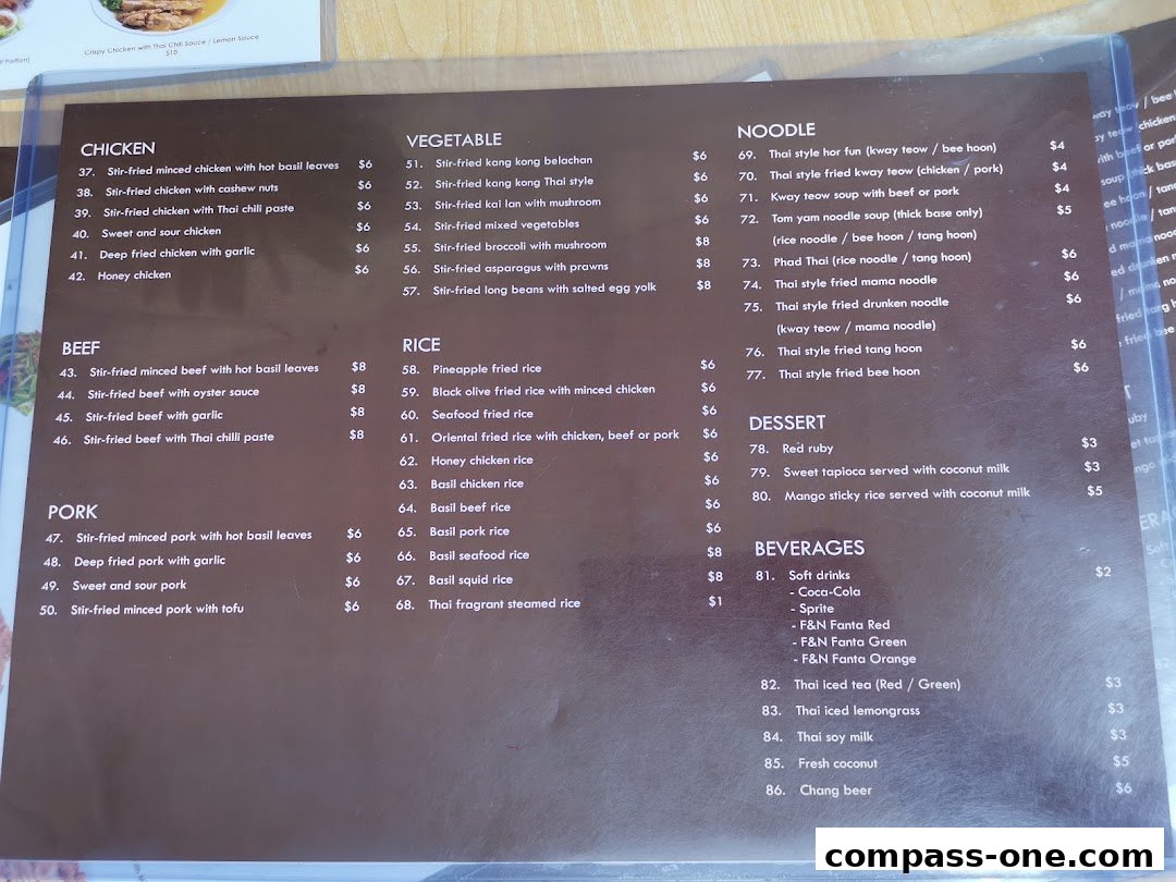 A menu from Nakhon Kitchen featuring Thai dishes like chicken, beef, pork, vegetables, noodles, rice, desserts, and beverages.