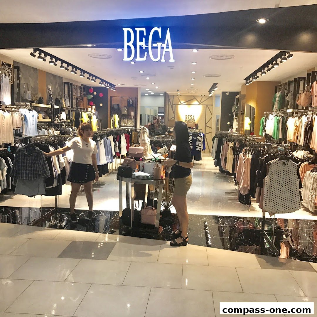 Two women browsing clothes inside a well-lit fashion boutique with racks of apparel.