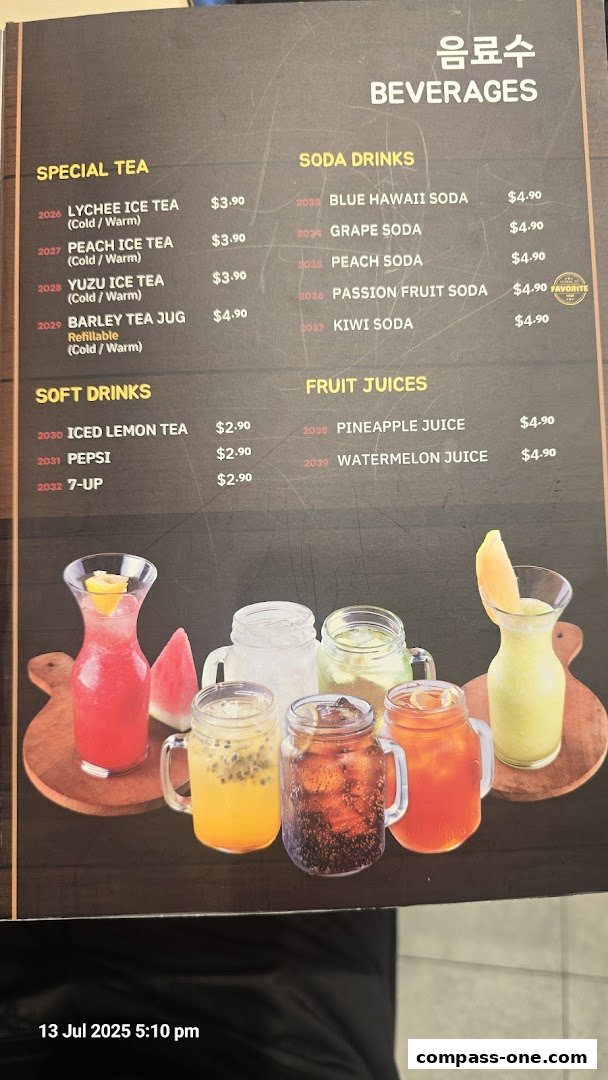 A menu featuring various beverages including special teas, soft drinks, soda drinks, and fruit juices.
