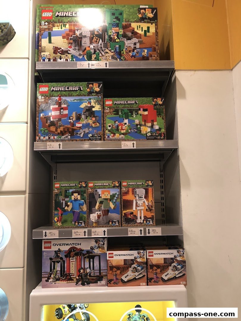 Shelves stocked with various LEGO Minecraft and Overwatch sets.