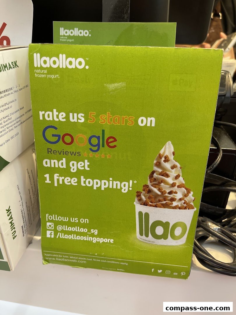 A sign for llaollao offering a free topping for a 5-star Google review.