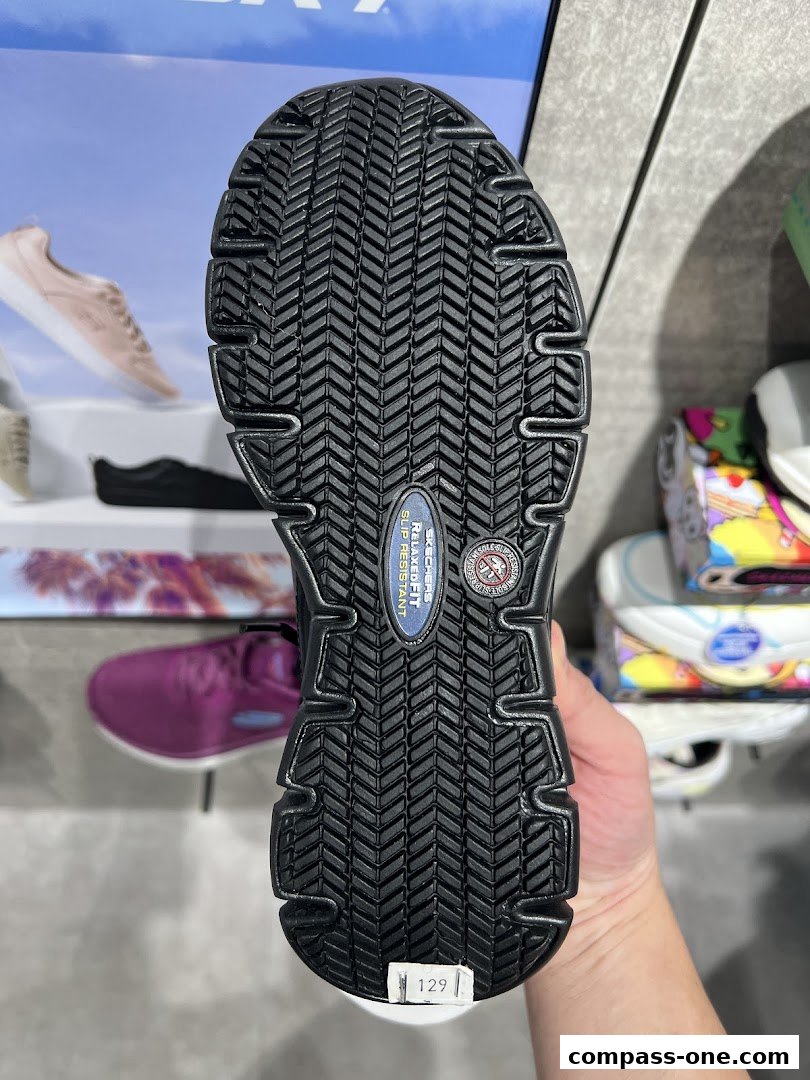 Close-up of a Skechers shoe sole, highlighting its slip-resistant tread pattern.