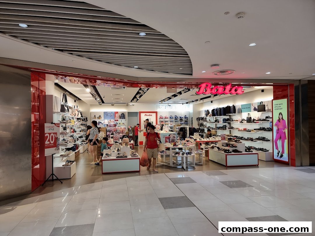 The Bata shoe store entrance showcases a wide variety of footwear and bags, with a prominent sale sign.