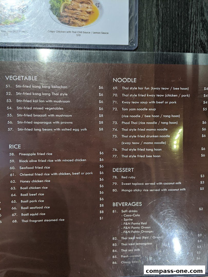 A menu from Nakhon Kitchen featuring Thai dishes like vegetables, rice, noodles, desserts, and beverages.