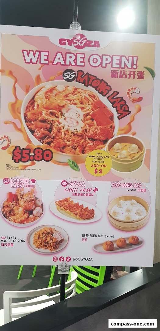A menu board showcasing various noodle dishes, dumplings, and buns from Kopitiam.