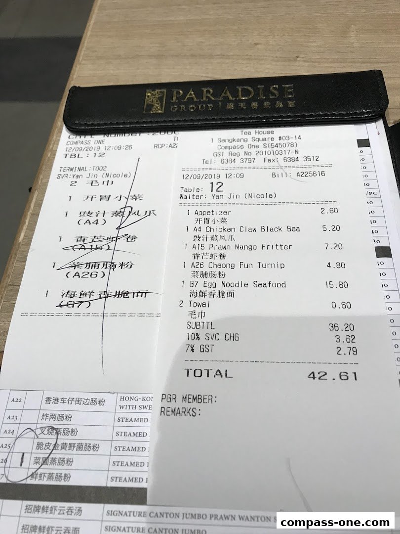 A close-up of a restaurant bill showing food items, prices, and total cost.
