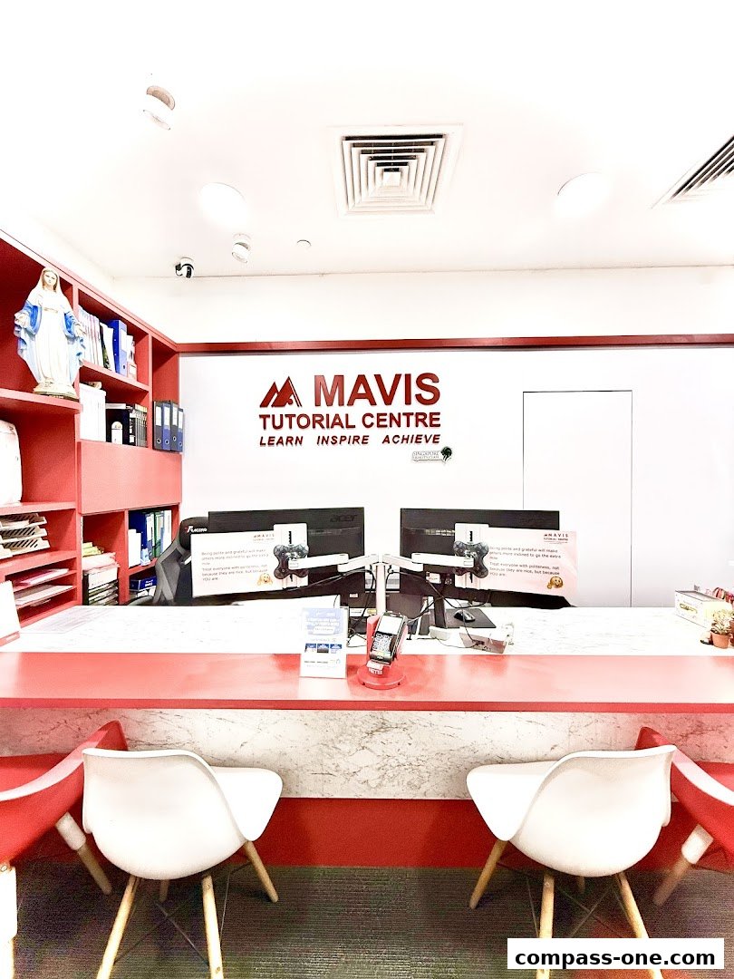 The reception area of Mavis Tutorial Centre with computers, chairs, and educational materials.
