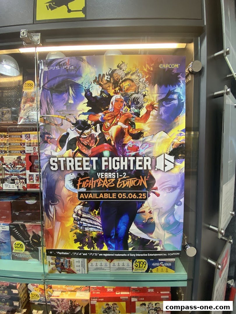 A display case in a game store featuring a Street Fighter Years 1-2 Fighters Edition poster.