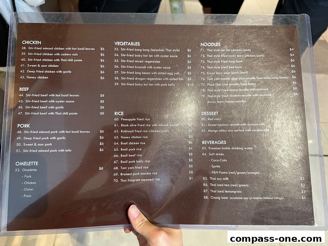 A menu from Nakhon Kitchen featuring Thai dishes like chicken, beef, pork, noodles, rice, and desserts.