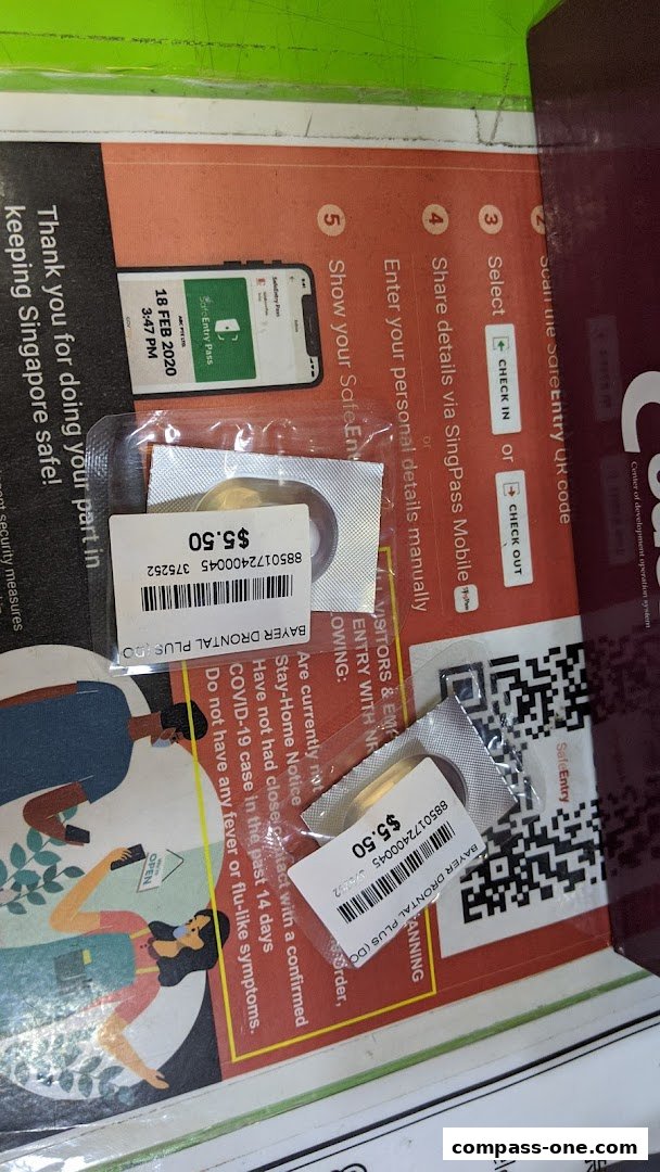 Two packages of Bayer Drontal Plus dog dewormer with price tags are displayed.