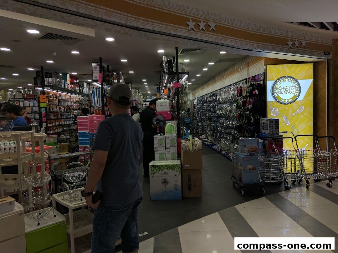 Interior view of Kim Able Household store showcasing a wide variety of kitchenware and home goods.