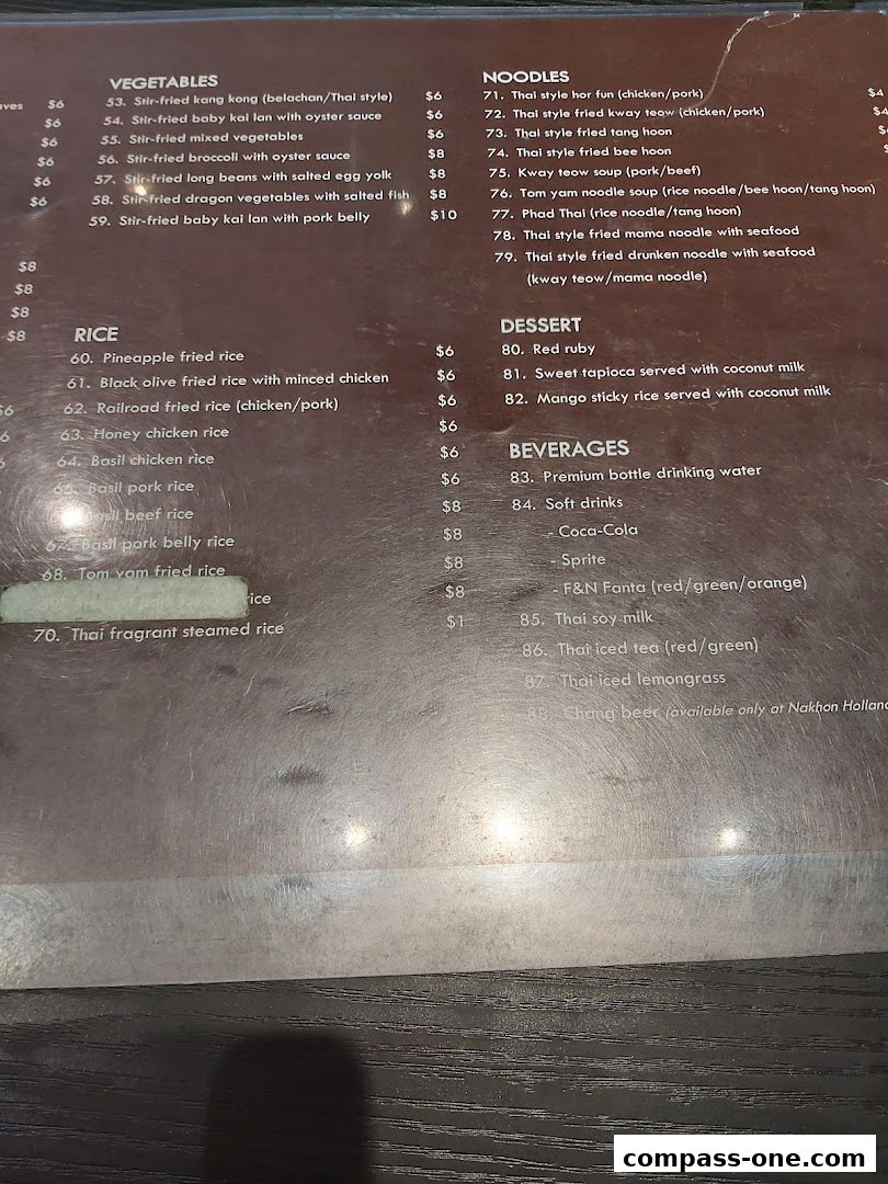 A menu from Nakhon Kitchen featuring Thai dishes like noodles, rice, vegetables, desserts, and beverages.