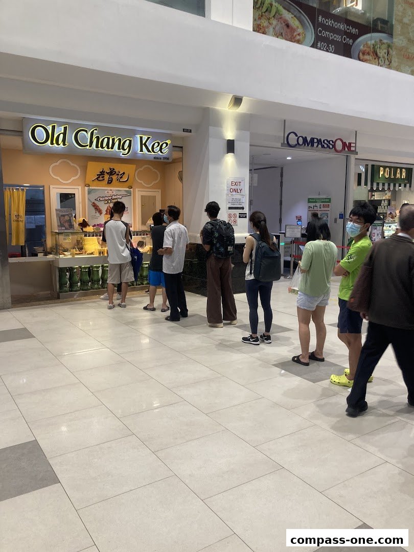 A line of customers waiting outside the Old Chang Kee shop.