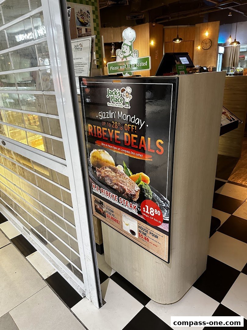 A promotional poster for Jack's Place restaurant featuring Ribeye Steak deals.