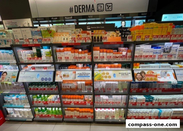 Shelves stocked with various skincare and health products, many with discount labels.