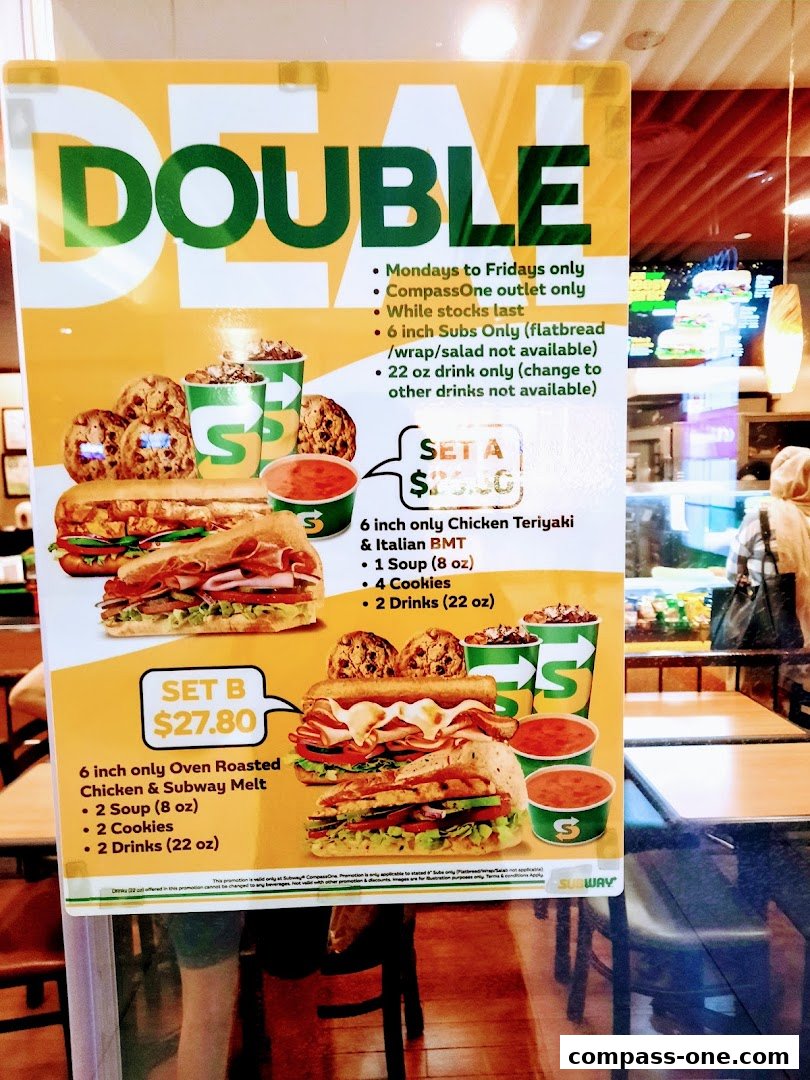 A promotional sign for Subway's 'Double Deal' featuring two meal set options with sandwiches, soup, cookies, and drinks.