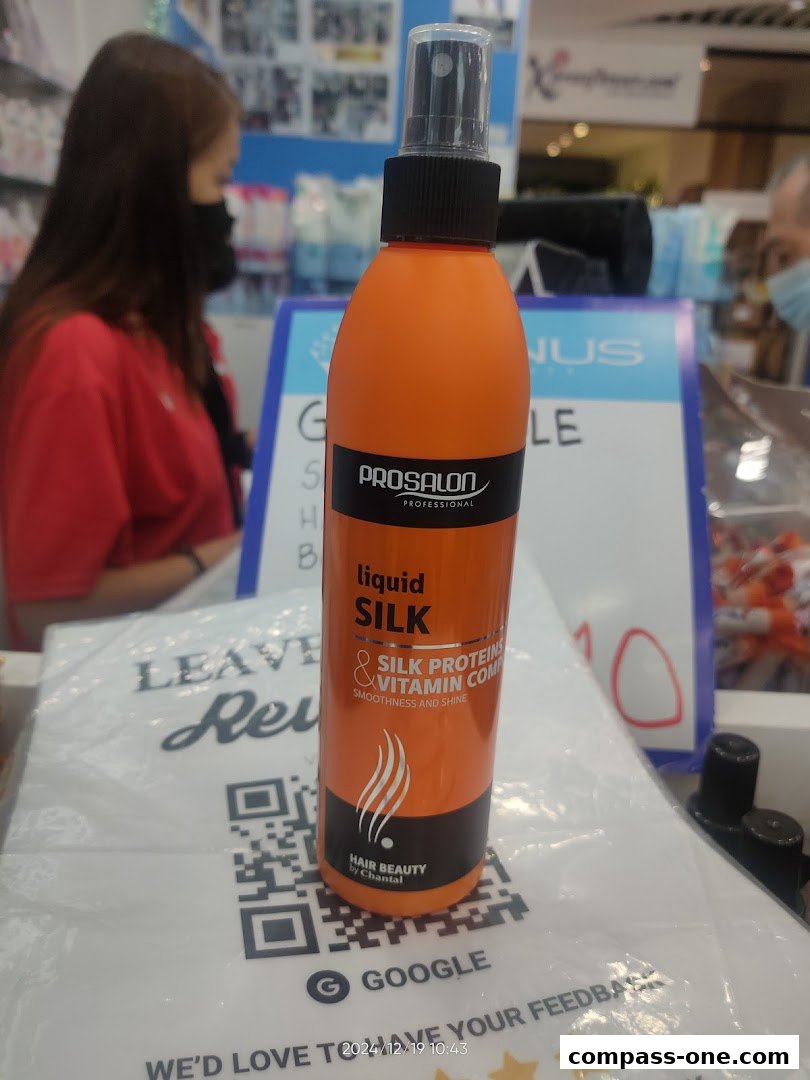 A bottle of Prosalon Liquid Silk hair treatment is displayed in a beauty shop.