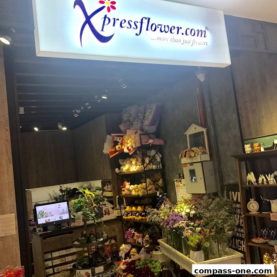A flower shop interior with bouquets, teddy bears, and decorative items.
