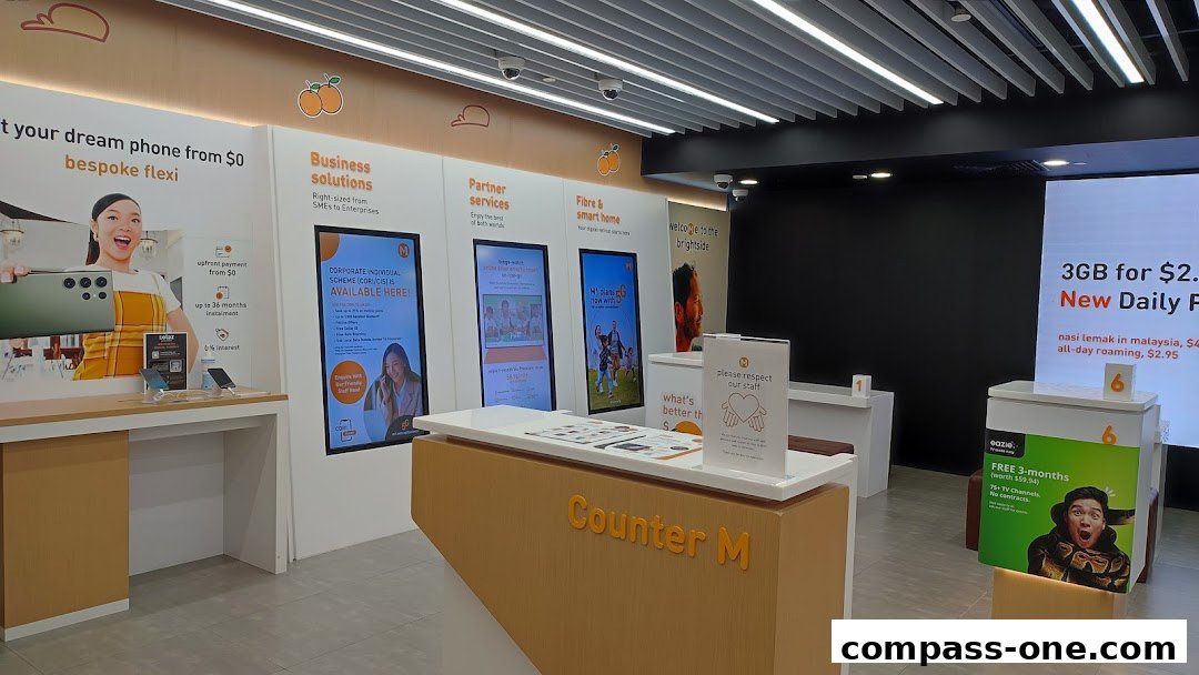 Interior of a modern phone shop with promotional displays and a service counter.