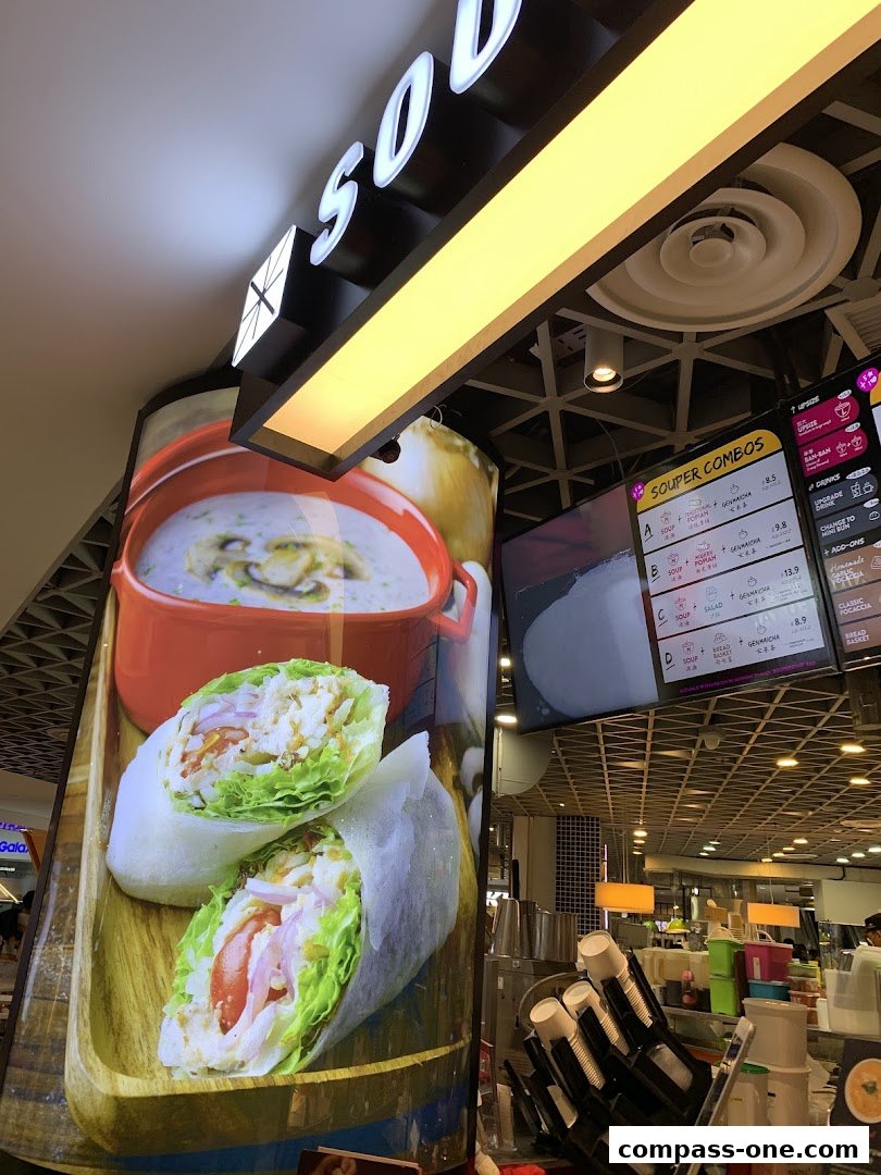 A digital menu board displaying soup combos and other food items at Souperstar.