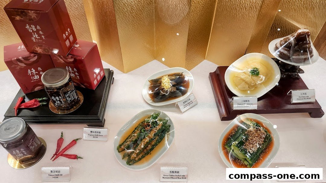 A display of realistic food models, including chili oil, chicken, and vegetables, with product labels.