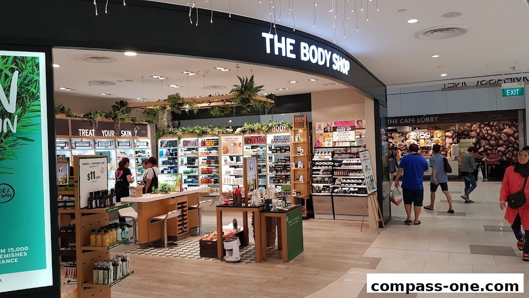 The Body Shop store interior with various skincare and makeup products displayed.
