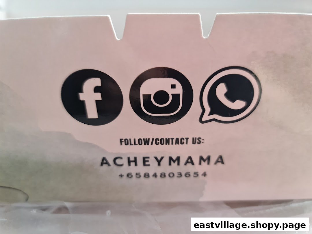 Close-up of Acheymama's social media icons and contact number on packaging.